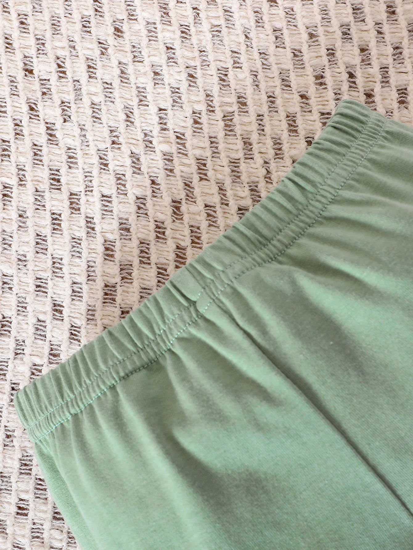 Elasticated waste band - makes it easy to put on your baby