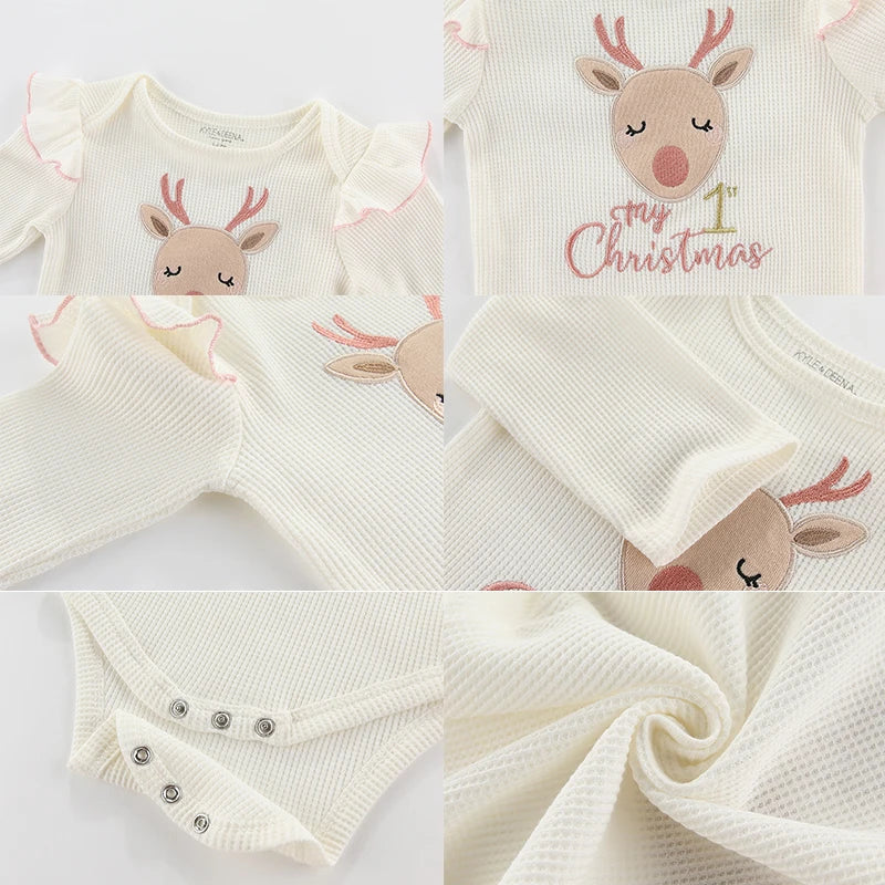 Baby onesie with reindeer design and 'My First Christmas' text