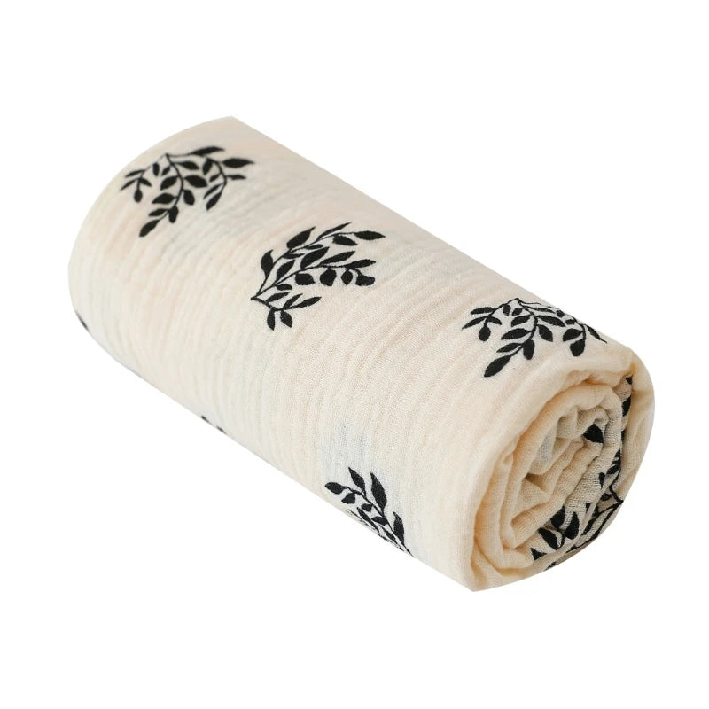 Rolled-up fabric with black leaf patterns