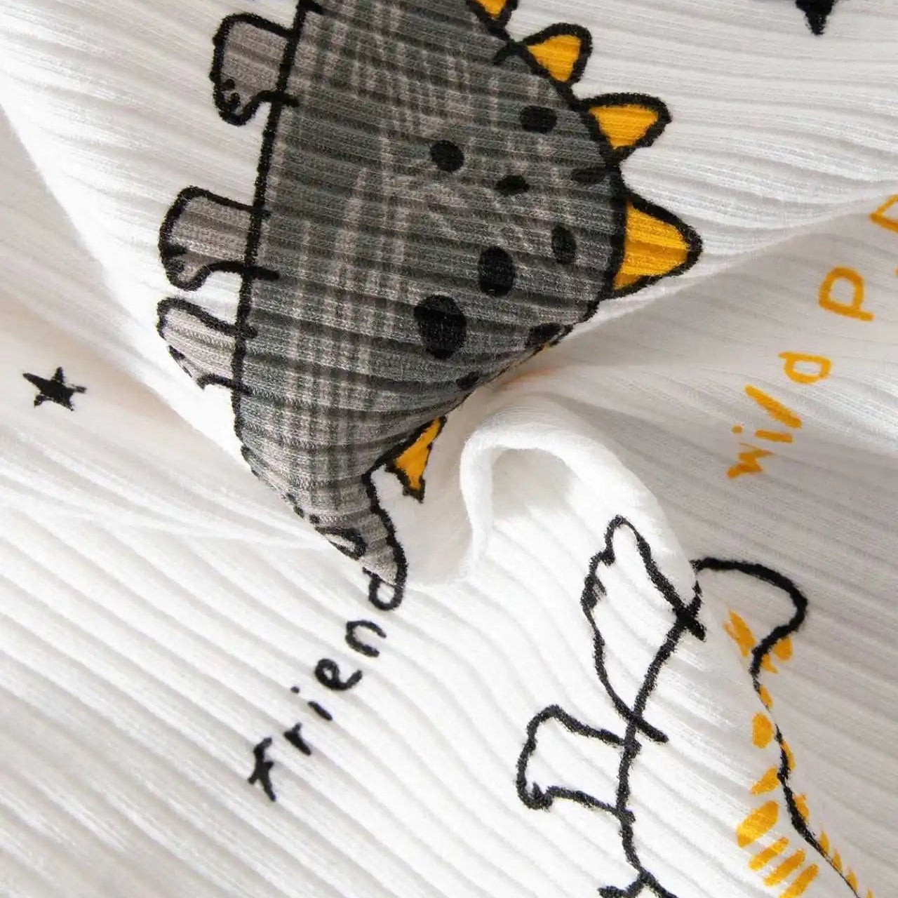 Close-up of a fabric with dinosaur