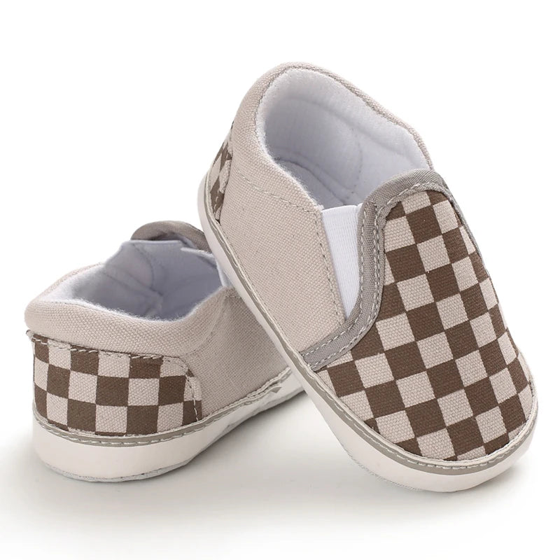 Brown and beige colored slip on baby by canvas shoes