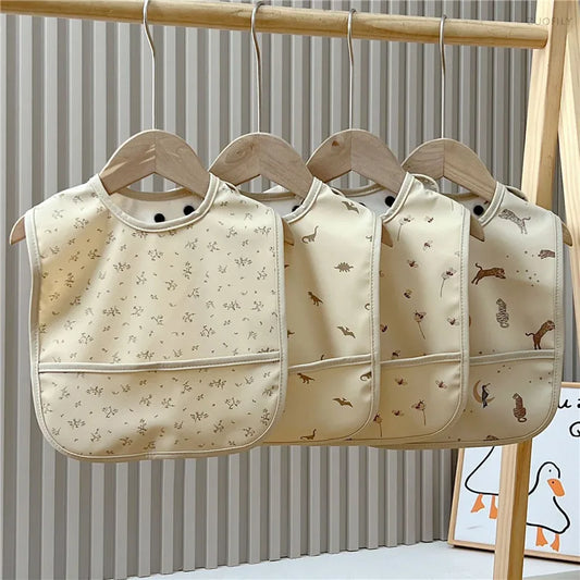 Three baby bibs with animal prints