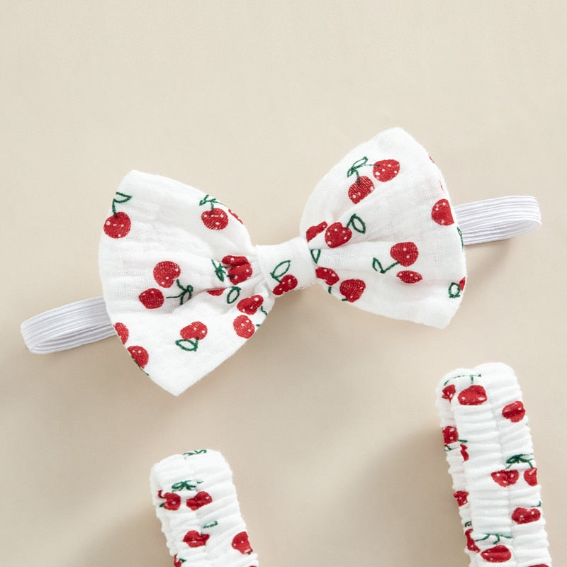 All romper suits come with a matching headband