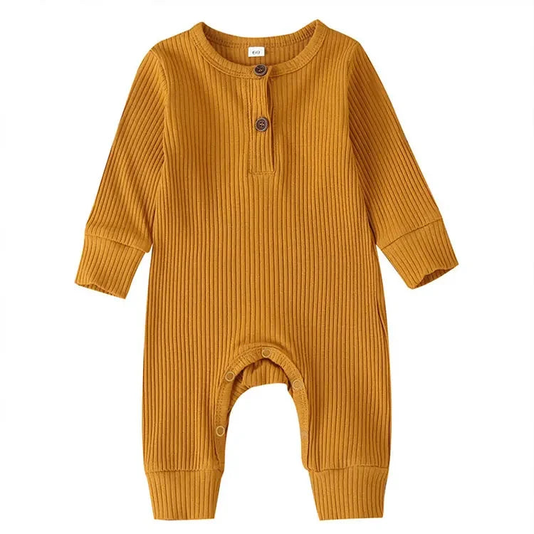 Mustard colored baby romper suit