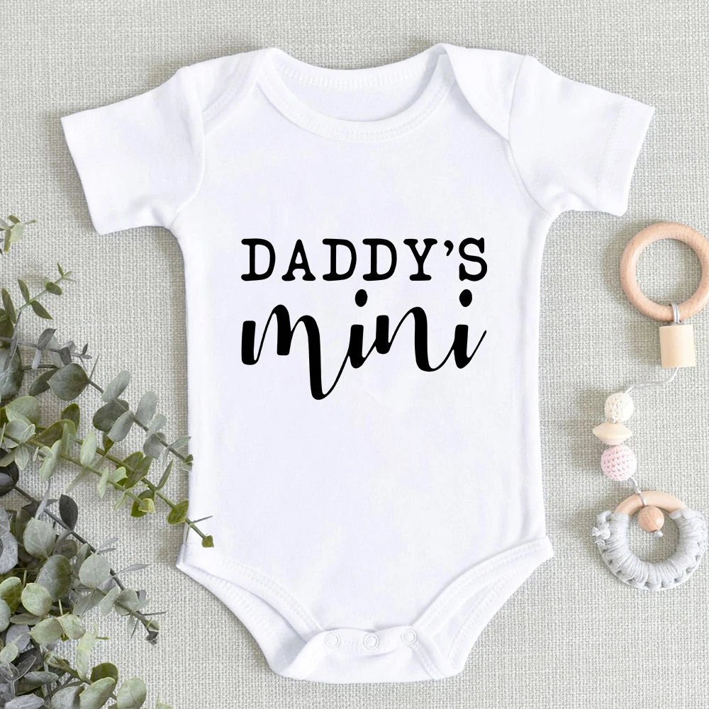 Cute words on a baby girl or boy romper suit