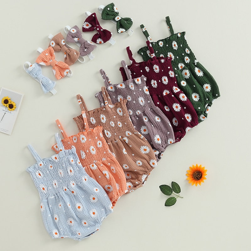 Lots of different coloured daisy print romper suits