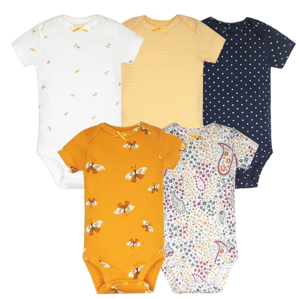 Set of five baby bodysuits in various patterns and colors