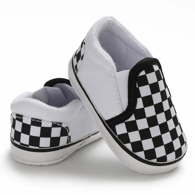 White and black square pattern slip on baby boy canvas shoes