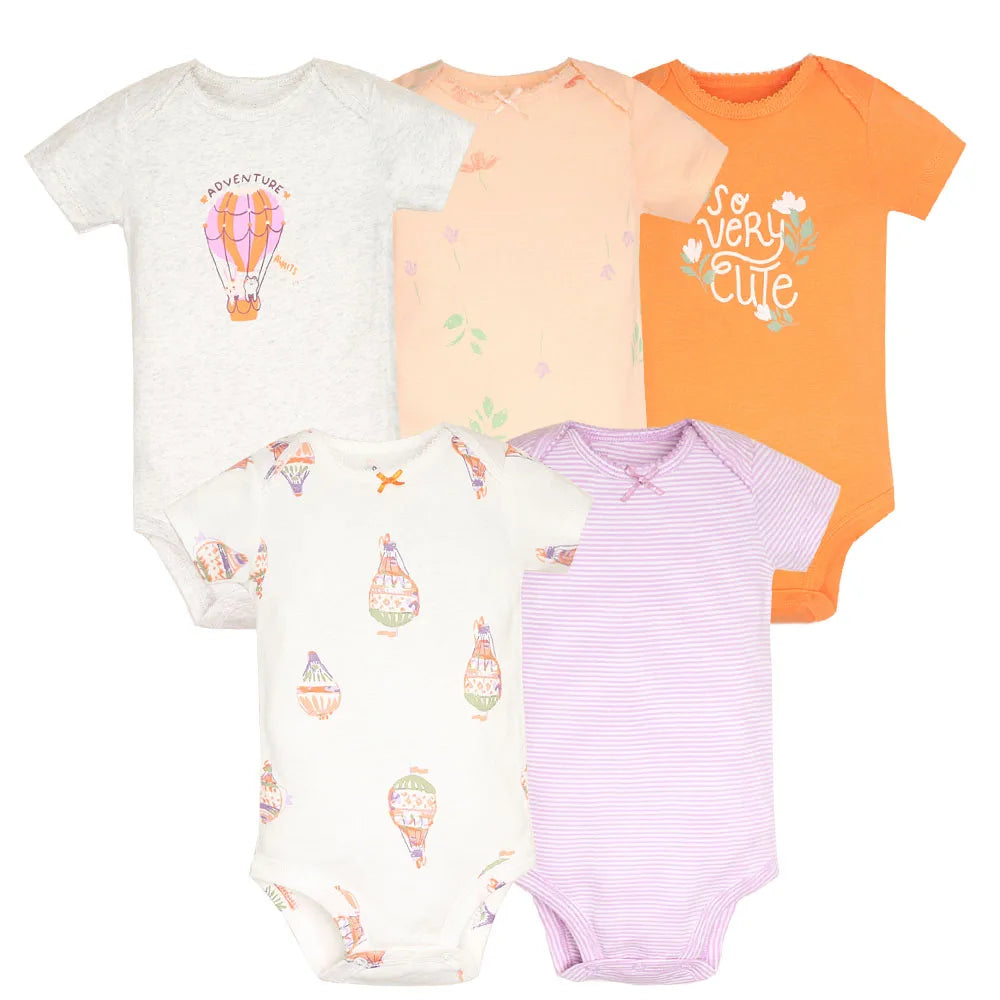 Set of five baby bodysuits in different colors with various prints