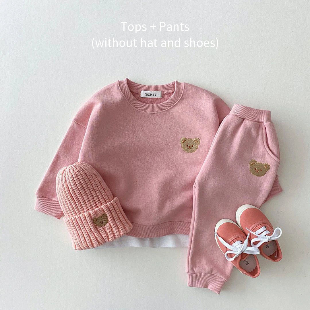 Pink children's outfit with bear embroidery