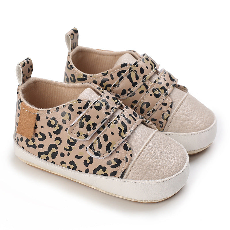 Pair of baby shoes with leopard print pattern