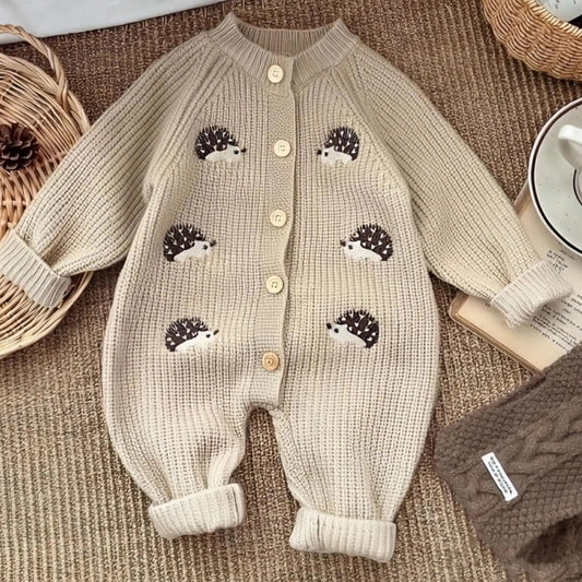 Beige baby romper with hedgehog designs