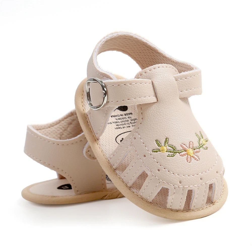 Lovely beige colored embroidered baby girl sandal
