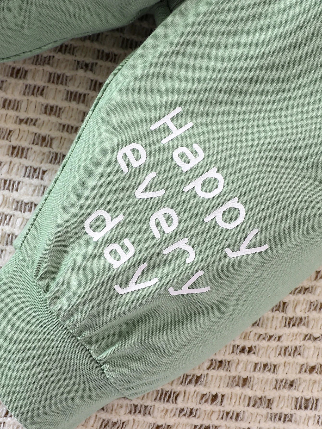 Cute words on the left leg of the baby joggers