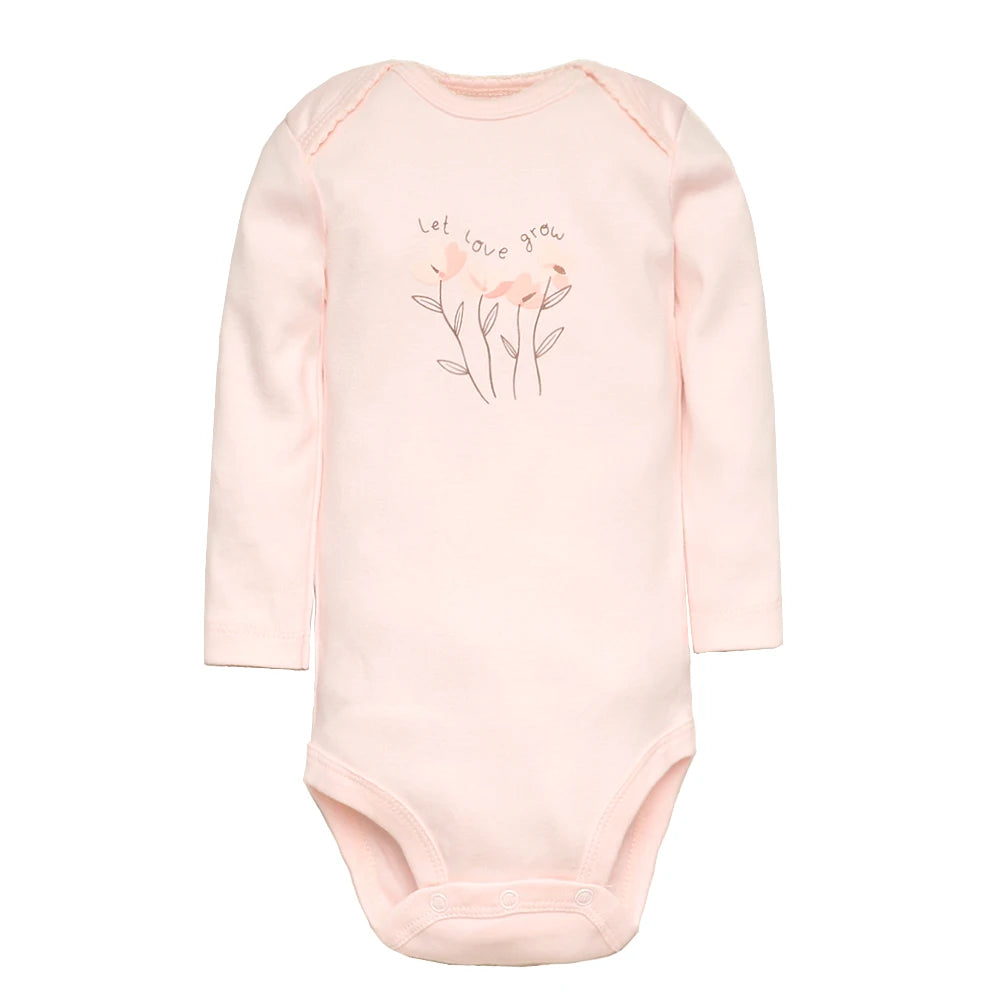Cream colored long sleeved romper suit