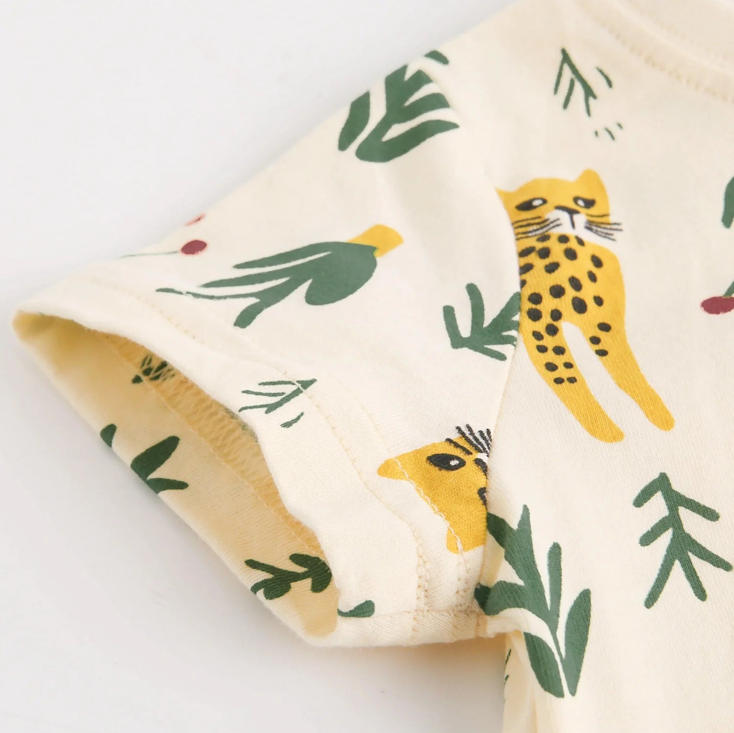 Folded fabric with cheetah and leaf pattern 