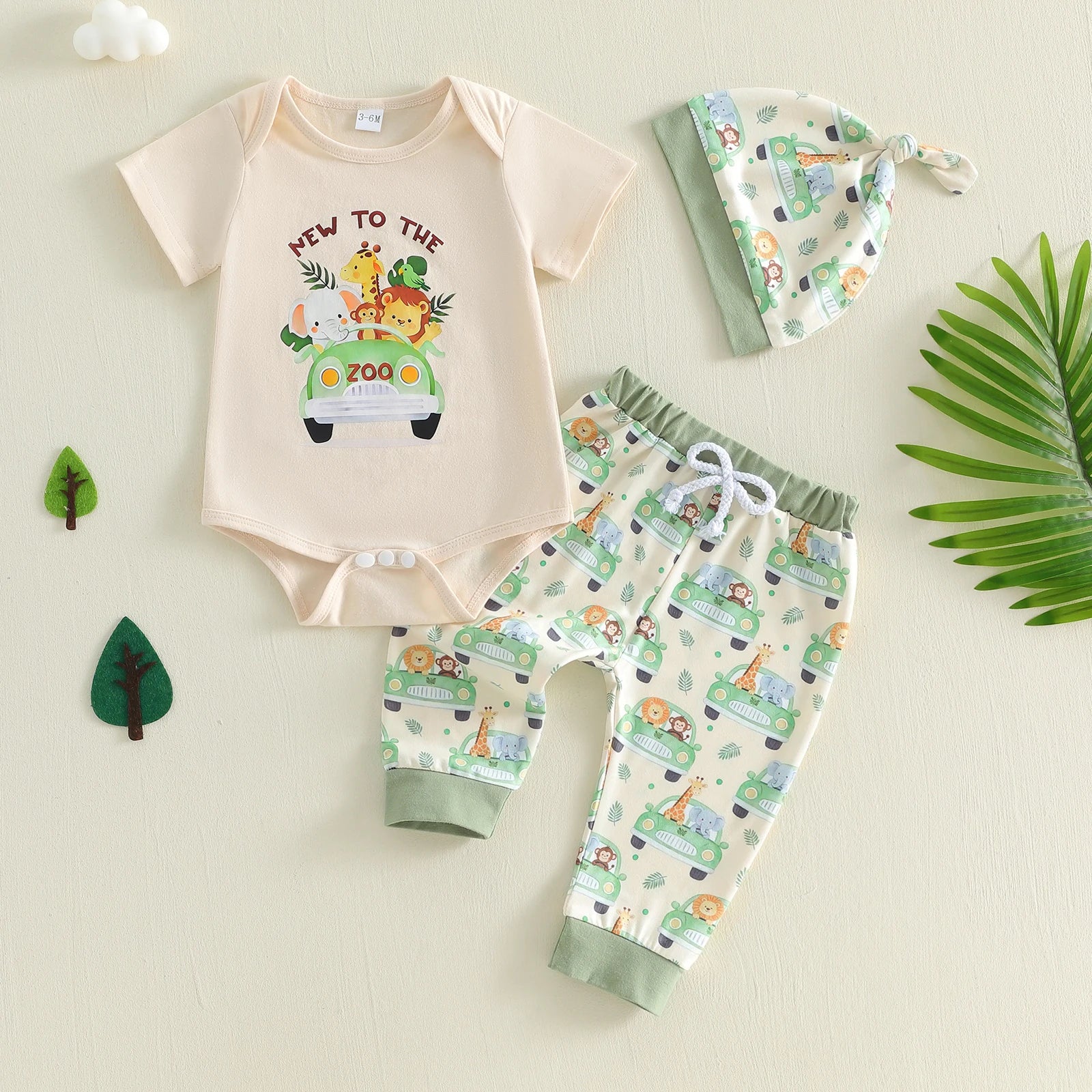 Baby outfit set with onesie, pants, and hat featuring animal and car patterns 