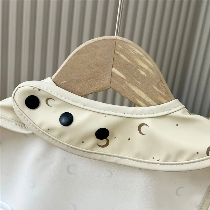Baby bib with celestial pattern
