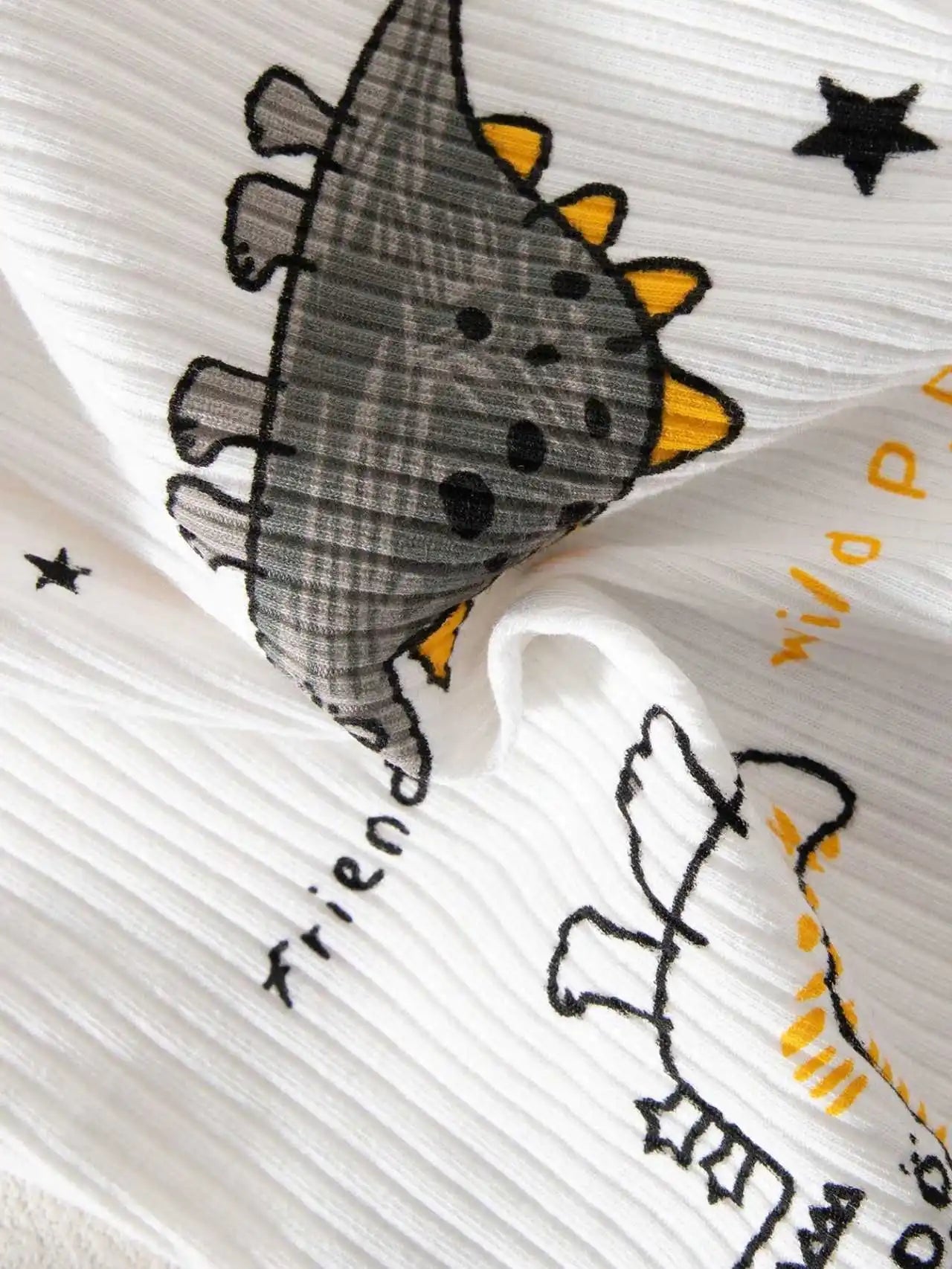Close-up of a fabric with dinosaur 