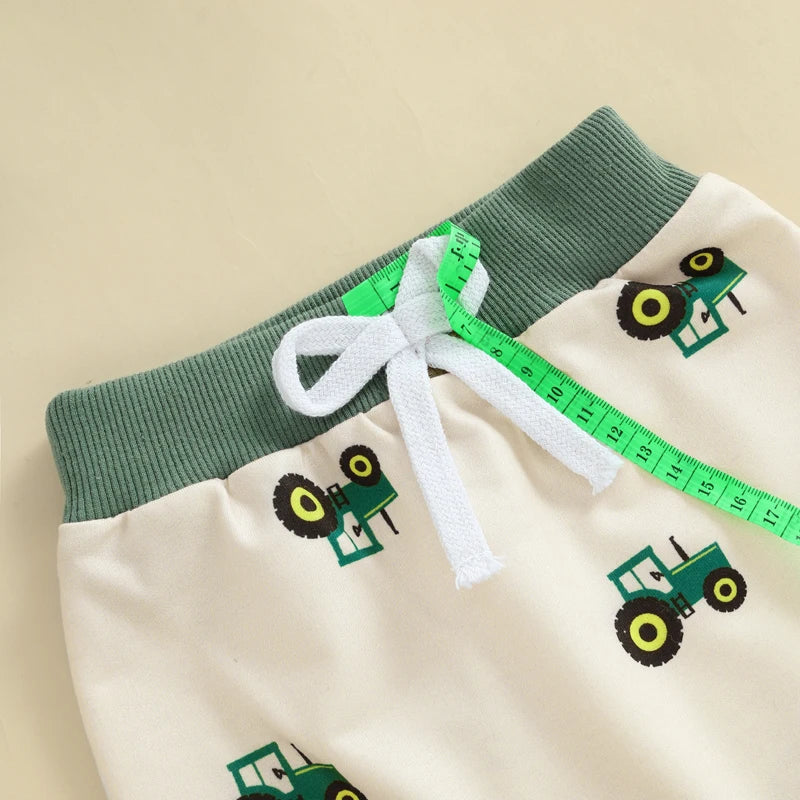 Children's shorts with green tractor pattern 