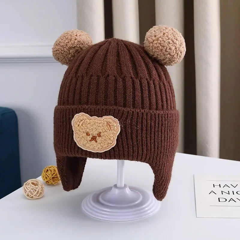 Brown knitted hat with bear ears and face 