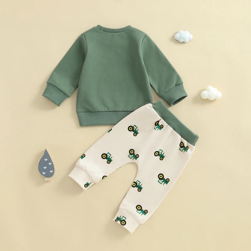 Children's green sweatshirt and beige pants with tractor pattern