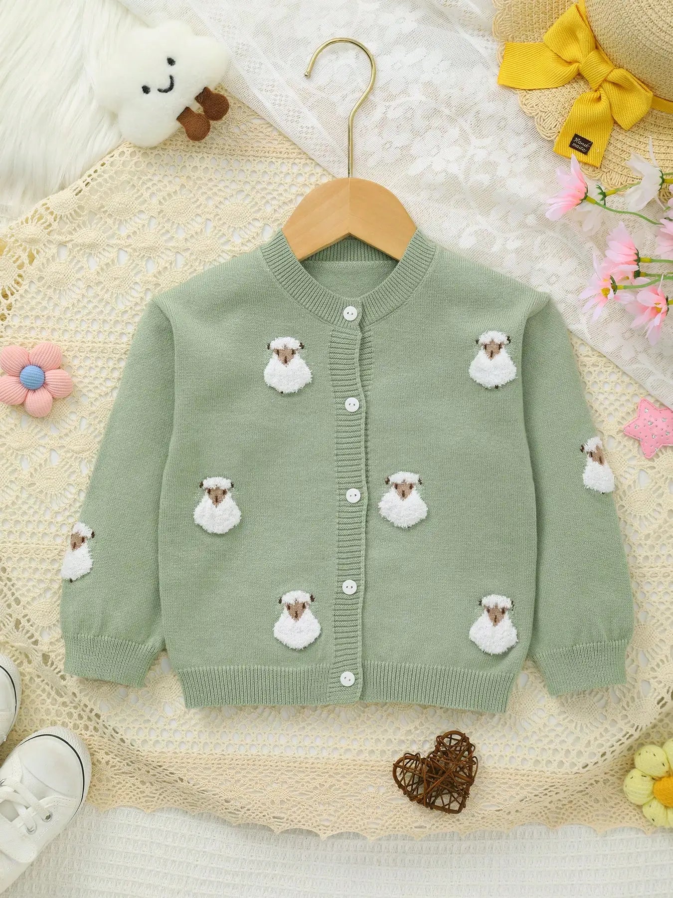 Green children's cardigan with sheep appliqués 