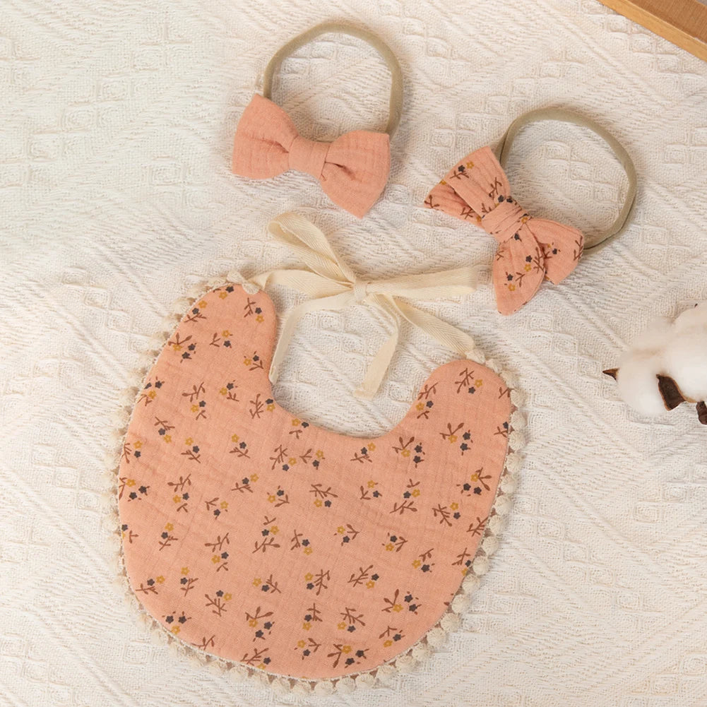 Peachy pink colored baby girl bib with cute hair bands