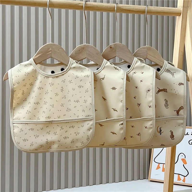 Three baby bibs with animal prints 
