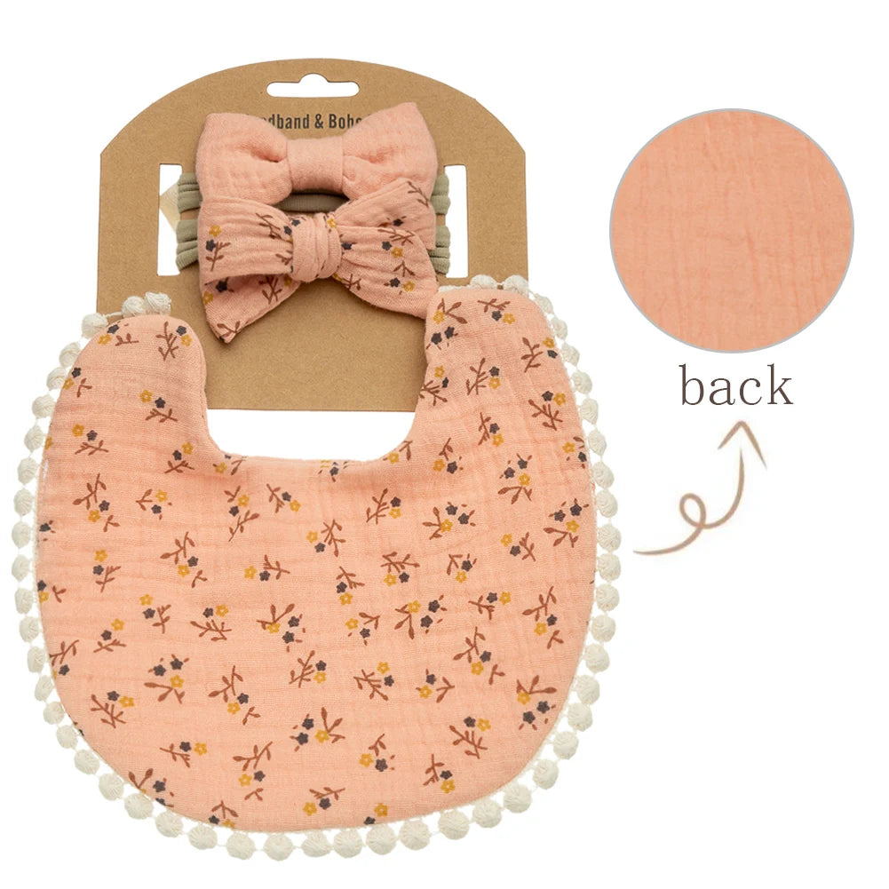 Peachy colored baby girl bib