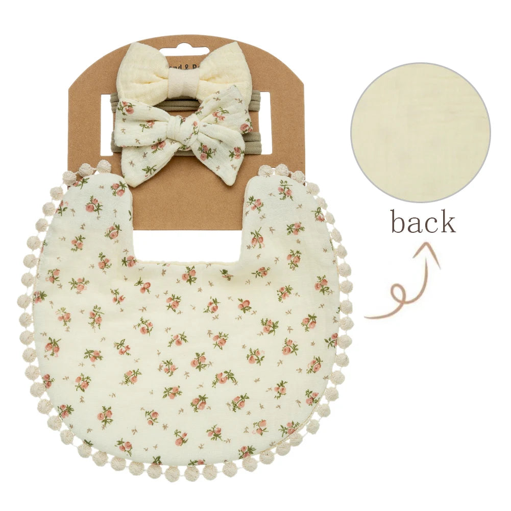 Lovely cream colored bib with small pink flowers