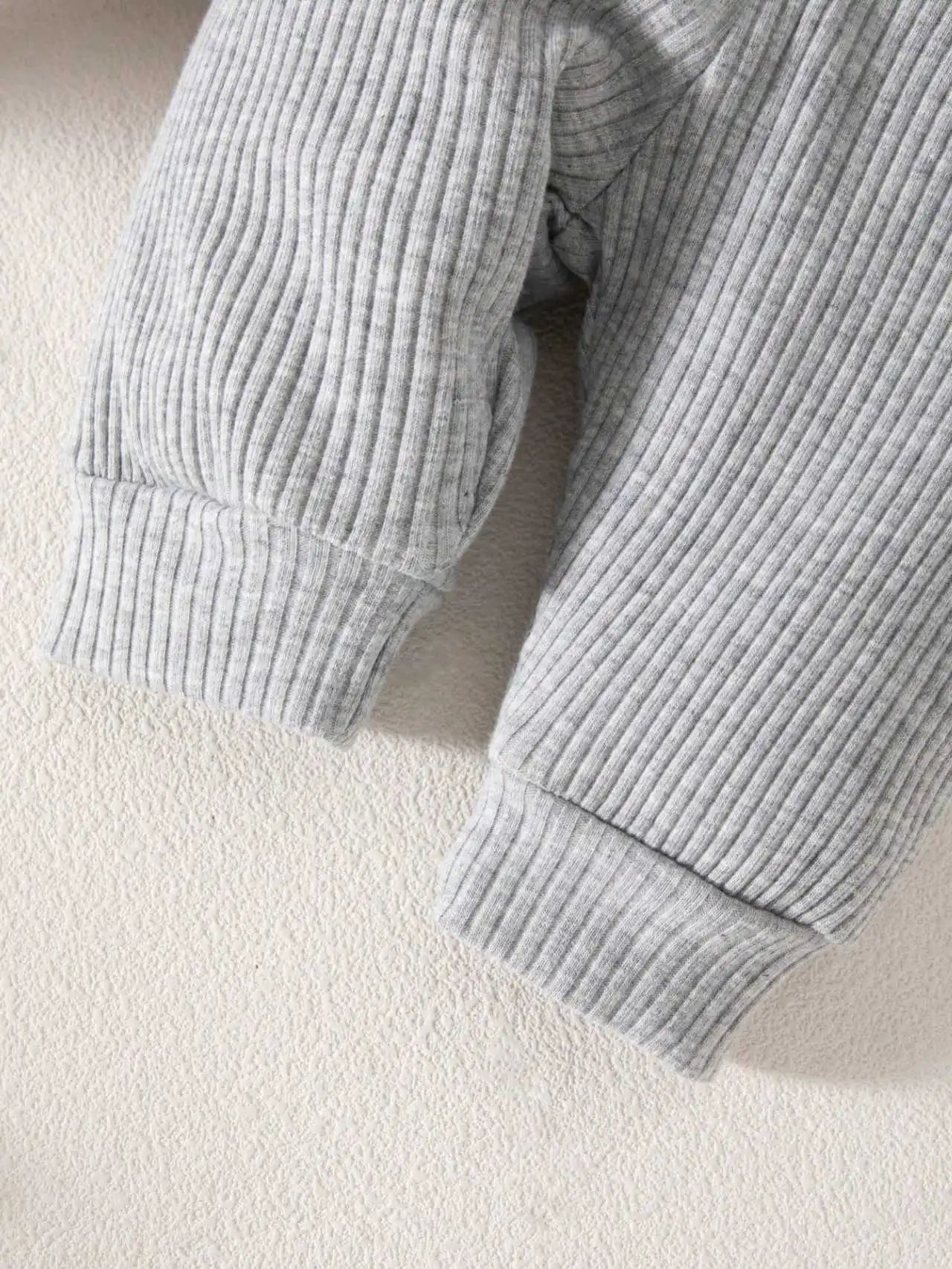 Close-up of a ribbed gray sweater 