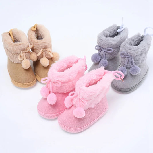 Very cute baby booties with pom poms