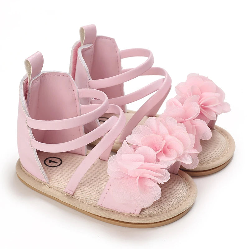 Pretty pink strappy sandals with soft pink flowers