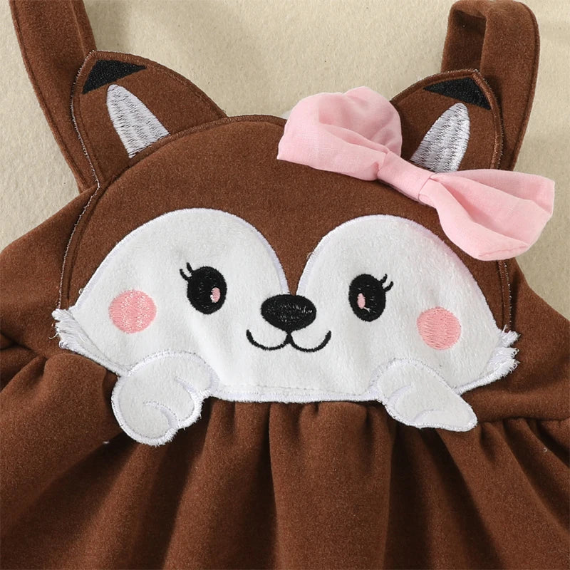 Brown plush toy with a white face and pink bow 