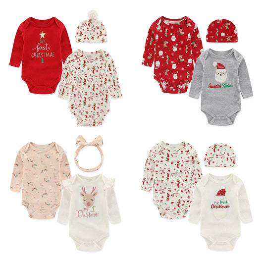 Collection of Christmas-themed baby clothing including onesies, rompers, and hats 
