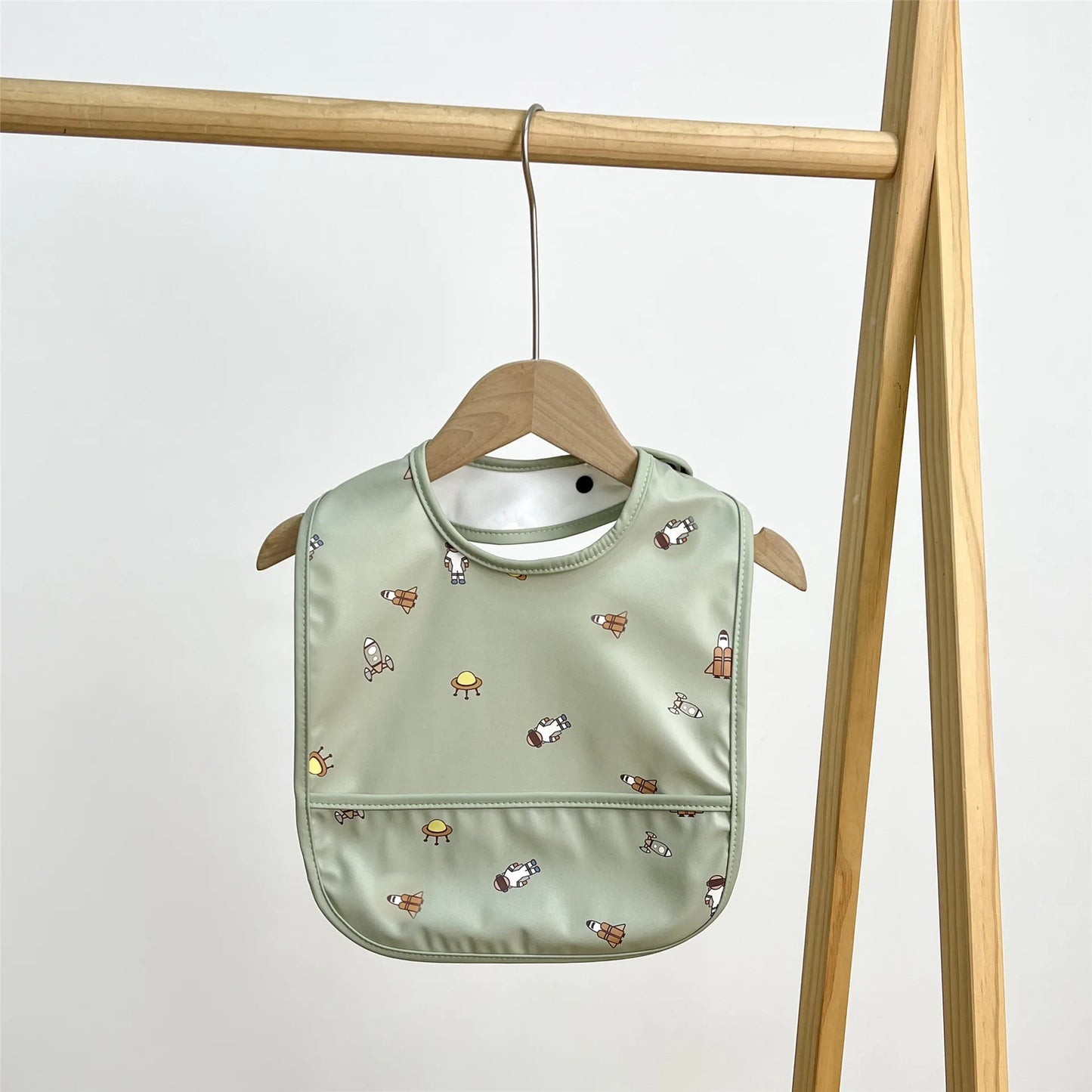 Green baby bib with animal prints 