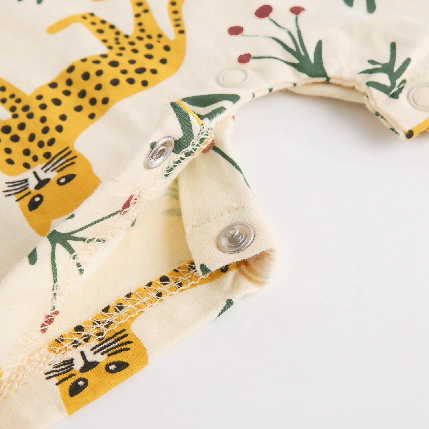 Close-up of a fabric with leopard and plant patterns 