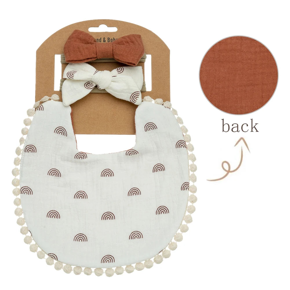 Lovely rainbow prints on a baby girl bib