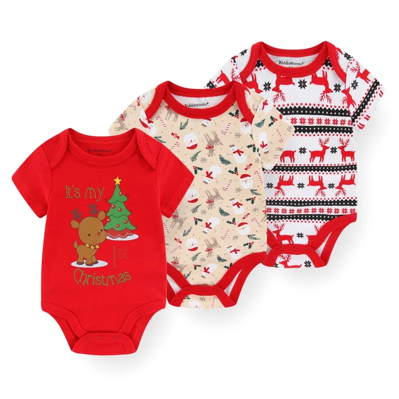 Three baby bodysuits with Christmas-themed designs 