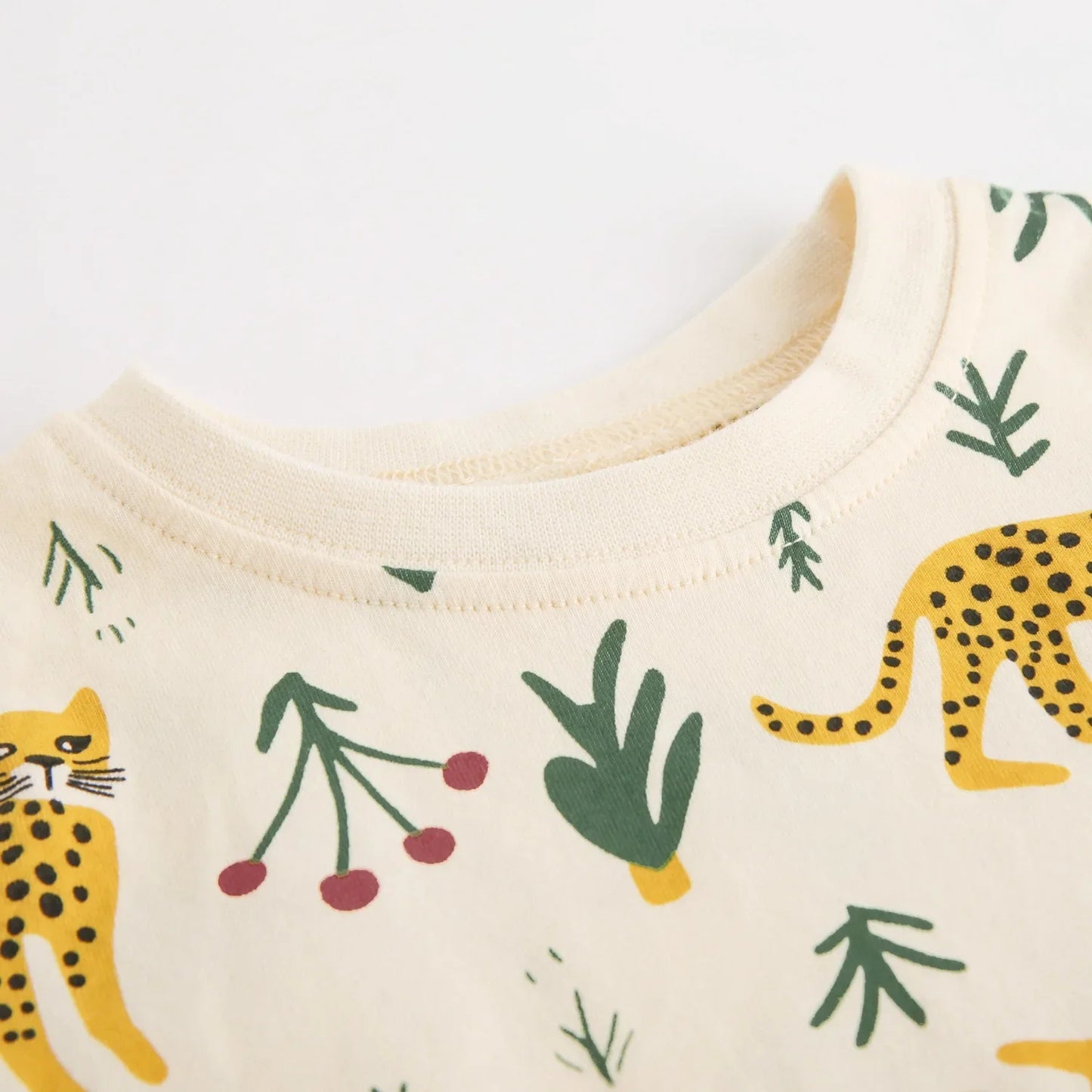 Close-up of a garment with leopard and plant pattern 
